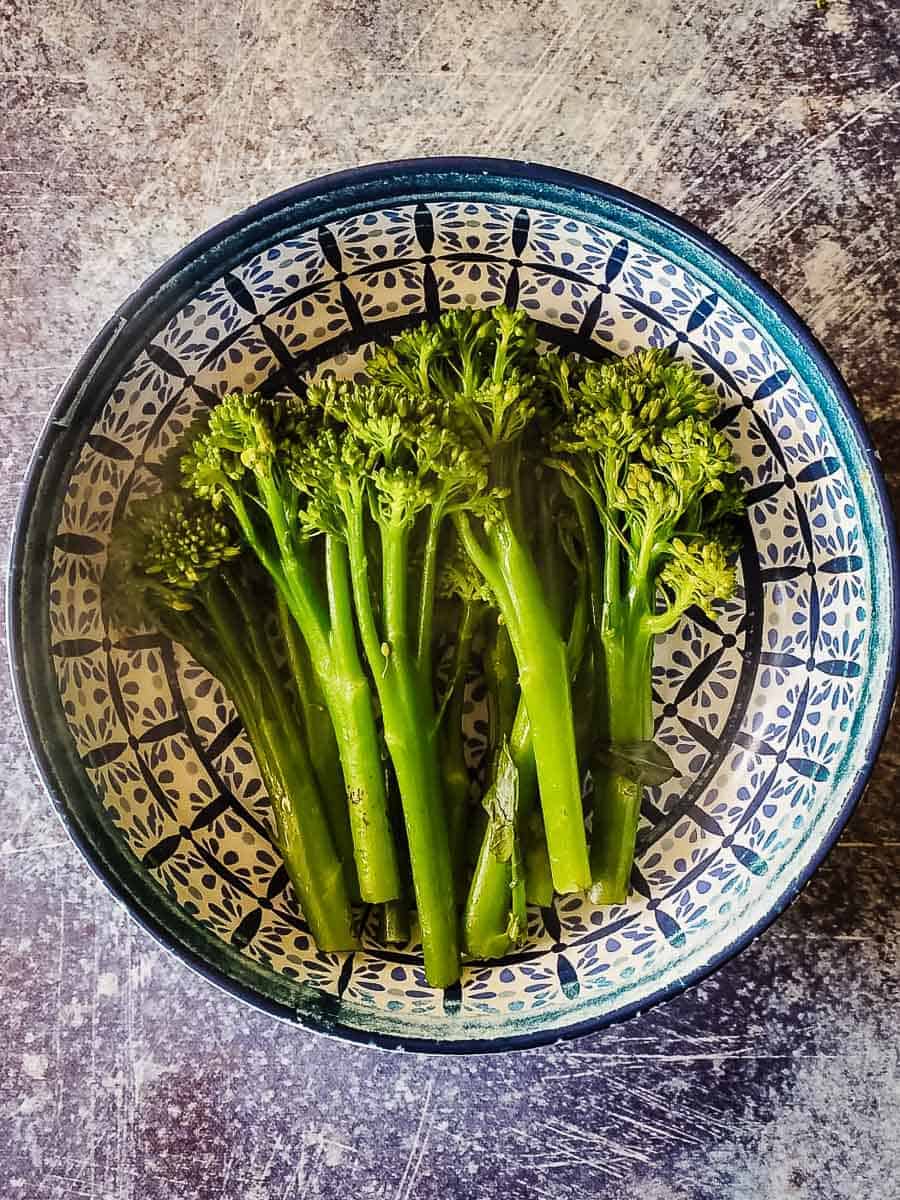 Steamed Broccolini in a bowl.