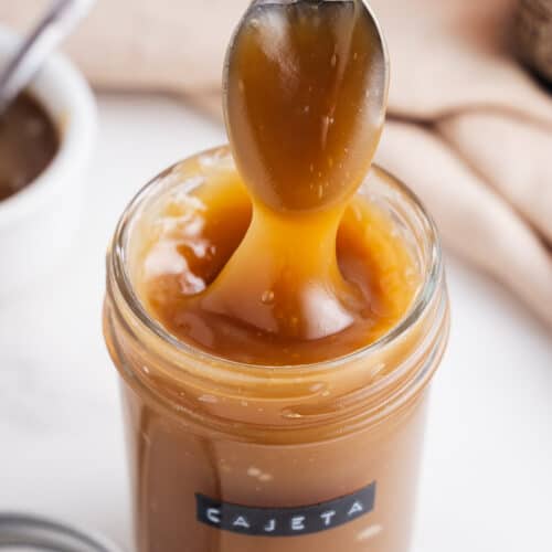 Spoonful of Vegan Cajeta Coming Out of a Jar