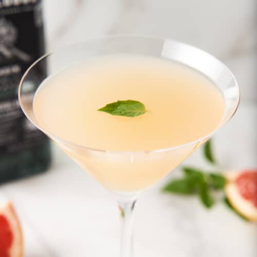 Grapefruit Basil Mezcalini in a Martini Glass.