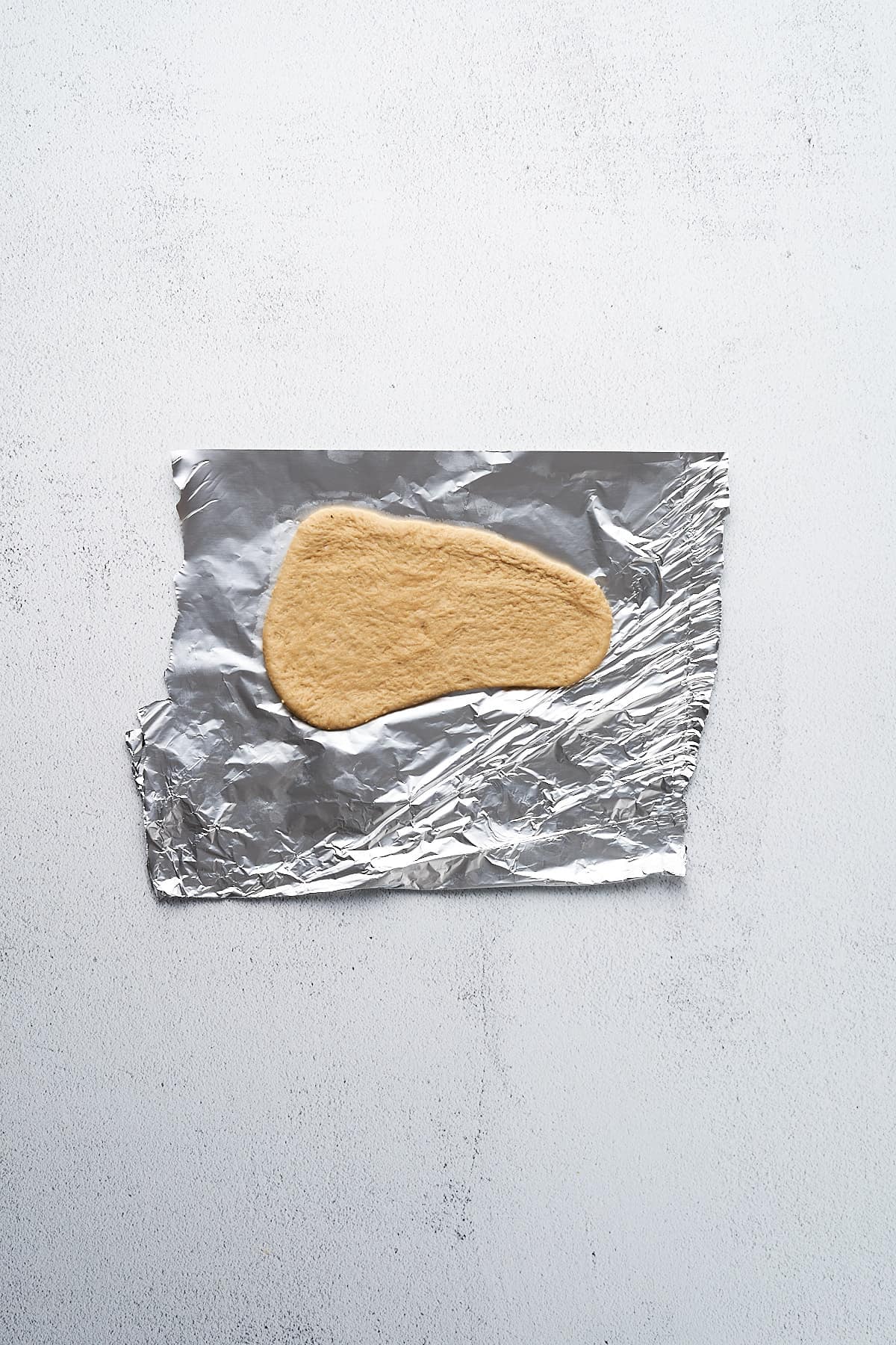 Rolled out piece of seitan.