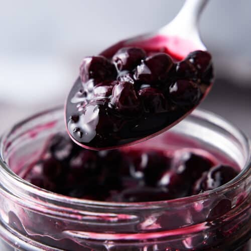 Blueberry compote on a spoon.
