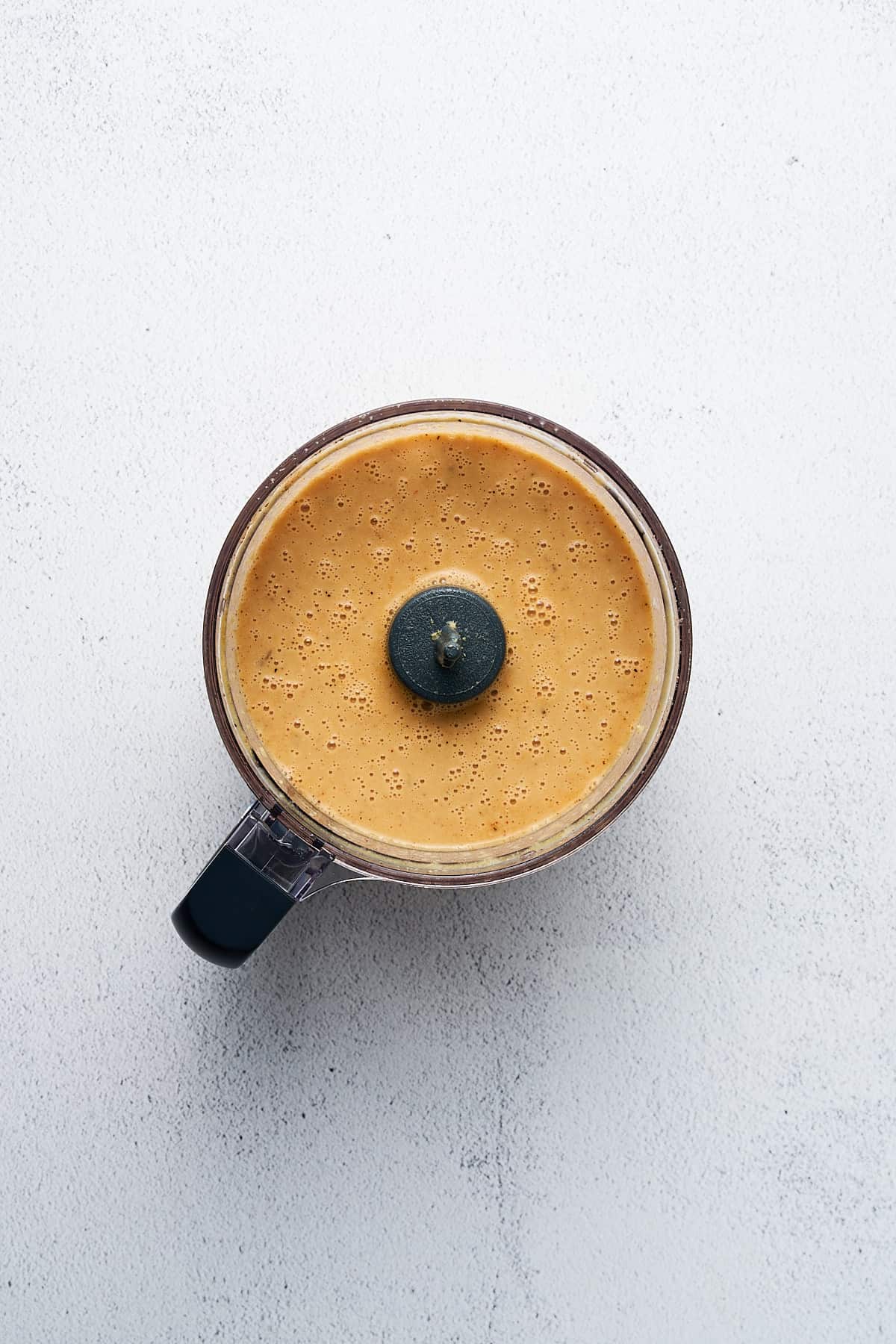 Blended chickpea mixture in a food processor.