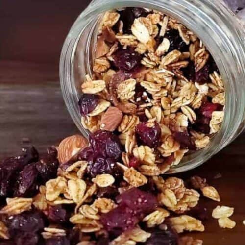 Vegan granola spilling out of a container.