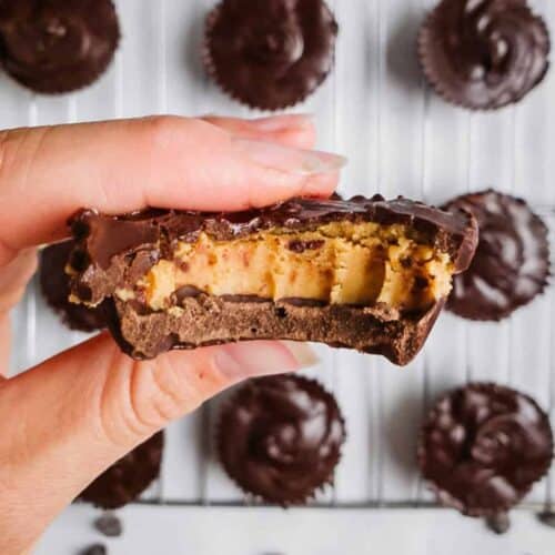 Vegan peanut butter cups with a bite taken.