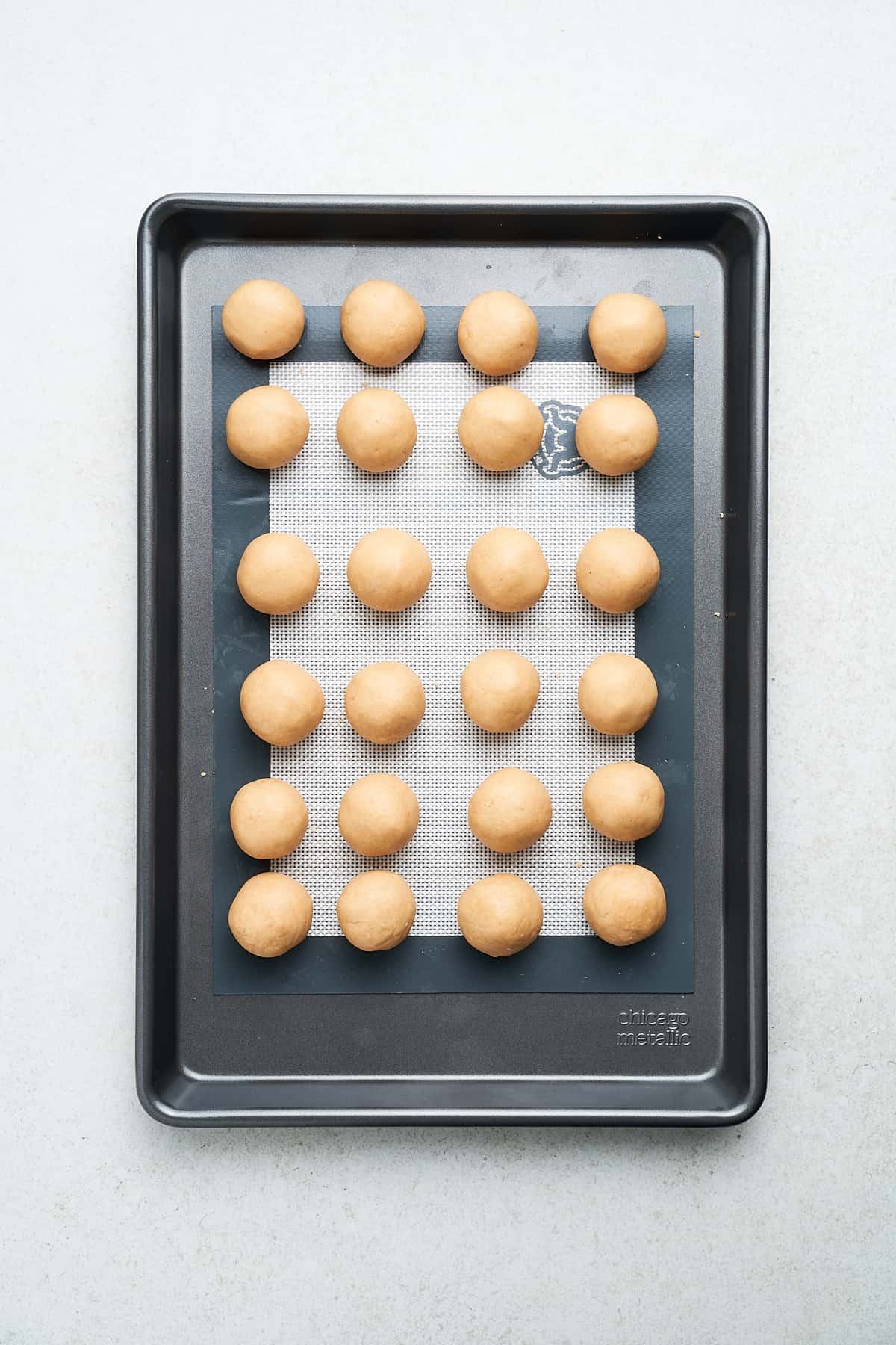 Buckeye candy balls on a baking sheet.