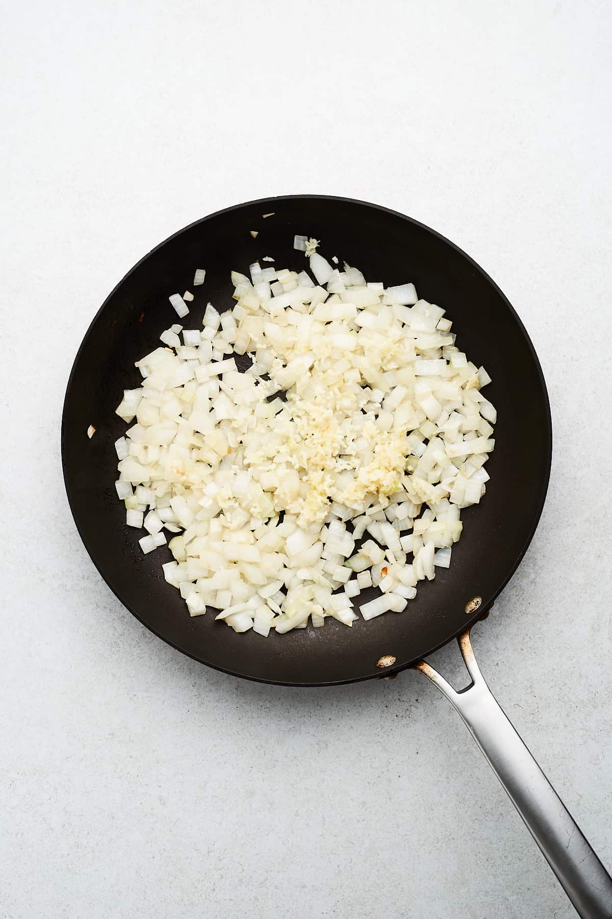 Onions and garlic in a pan.