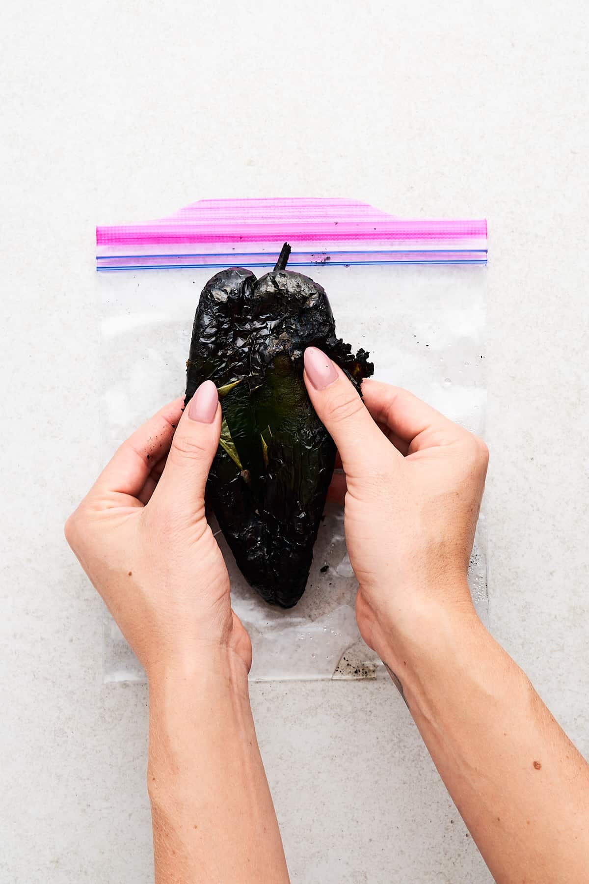 Peeling a poblano pepper.