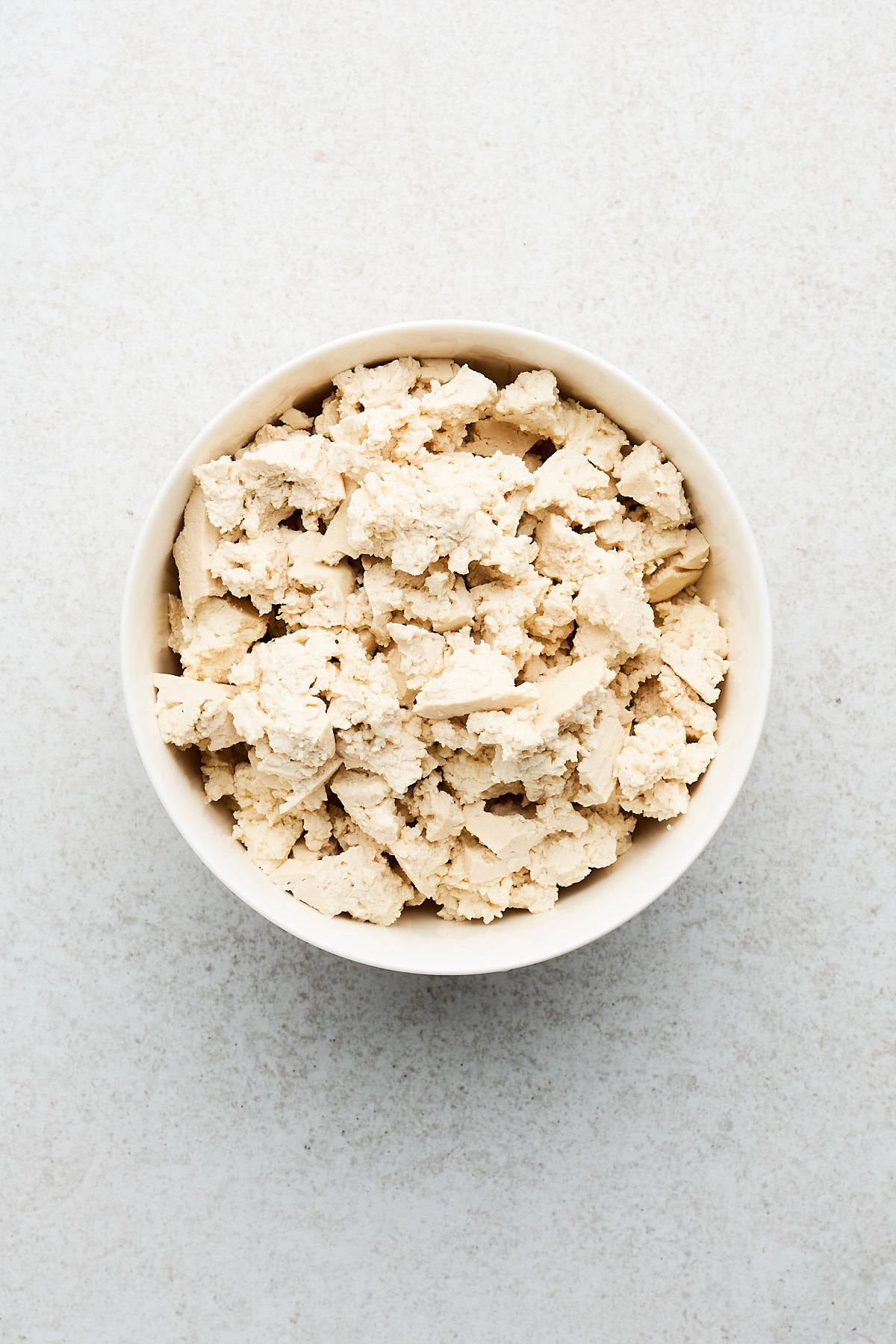 Crumbled tofu in a bowl.