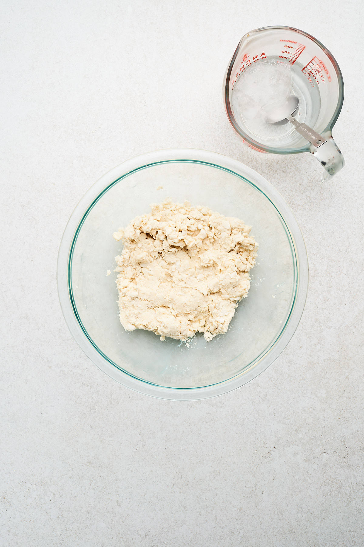 Pie dough in a mixing bowl.