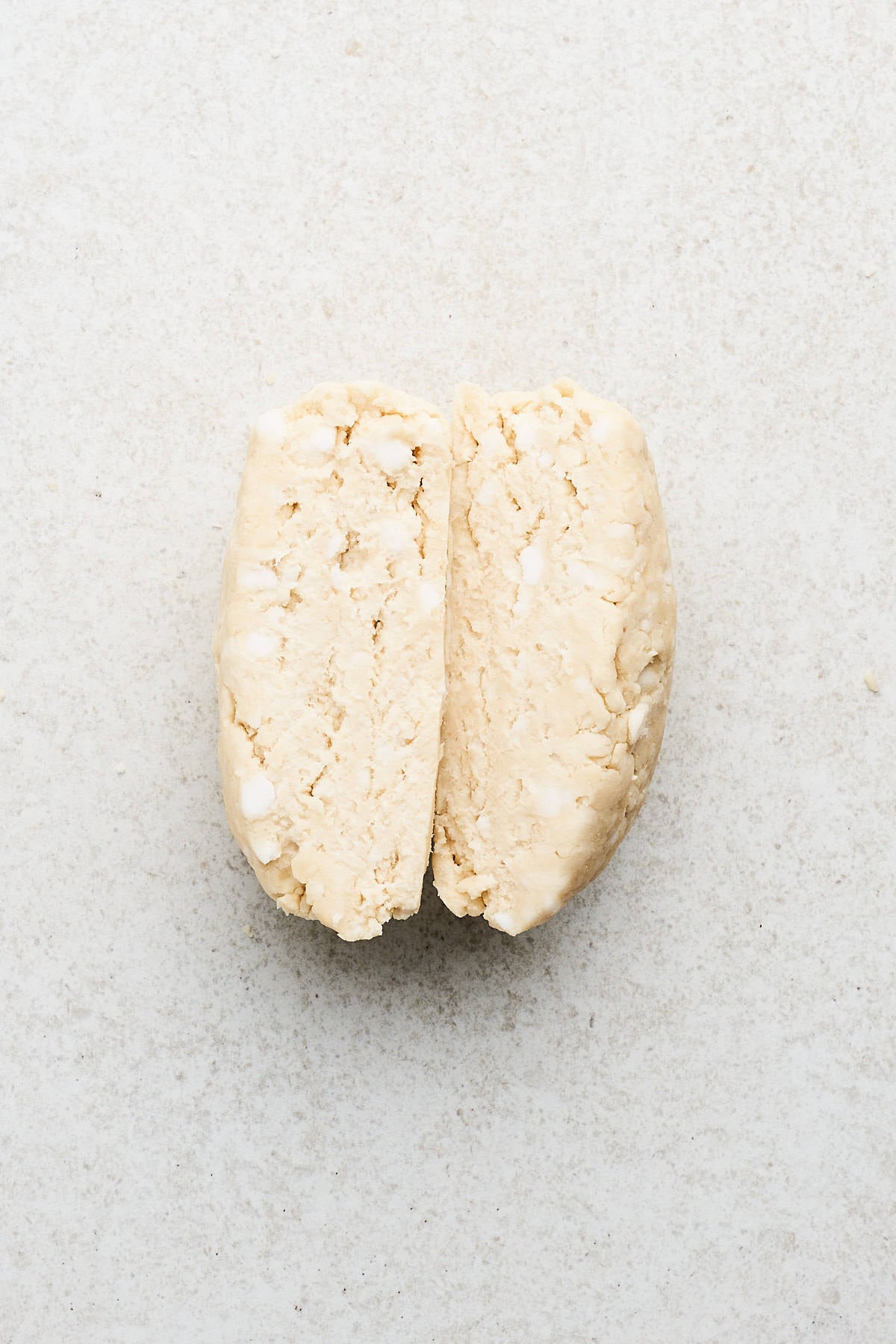 Pie dough cut in half.