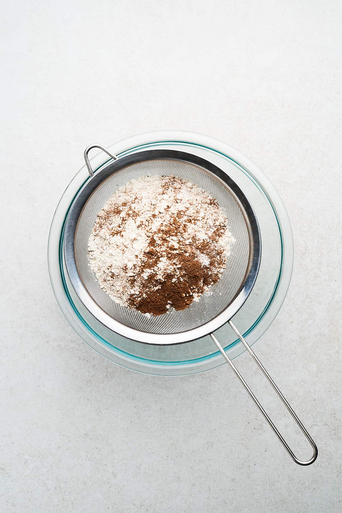 Flour and spices in a sieve.