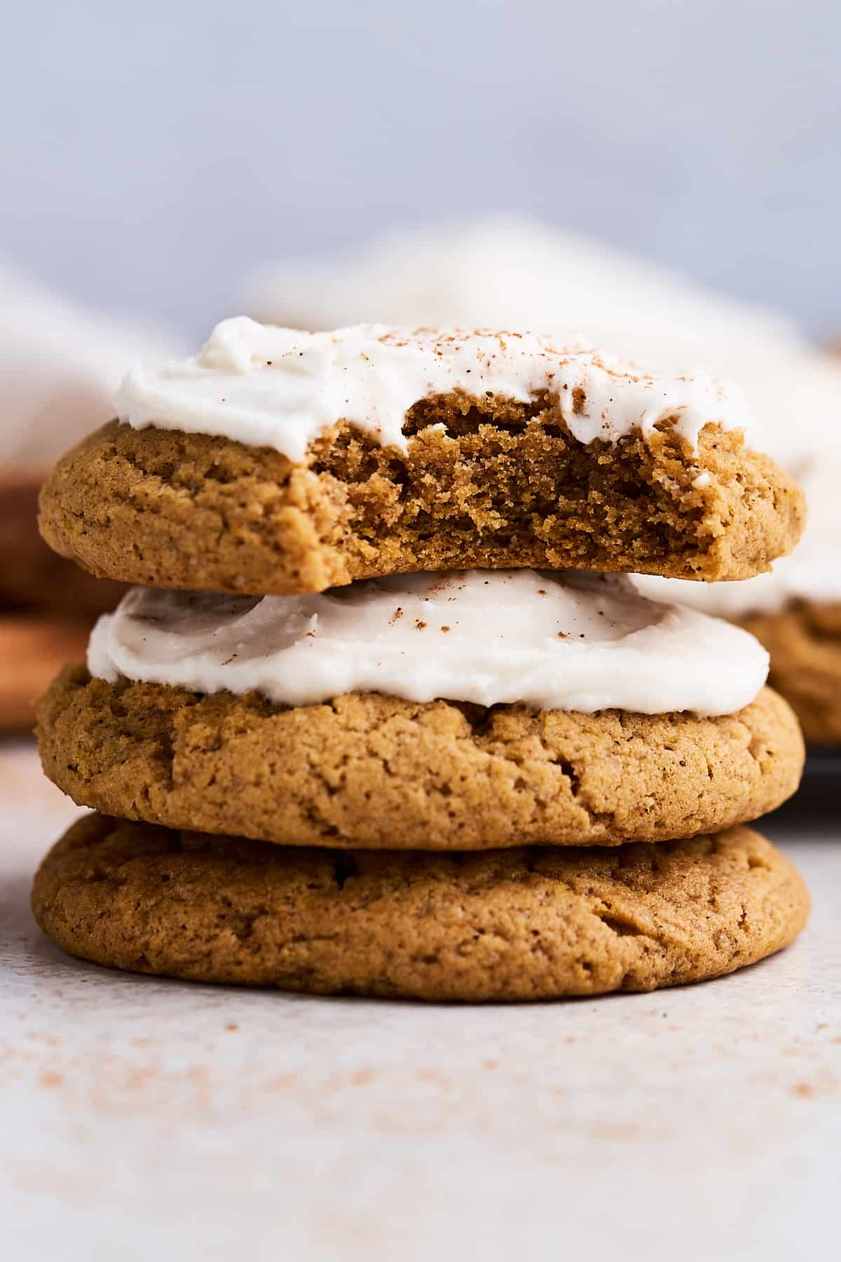 Stack of bitten vegan pumpkin cookies.