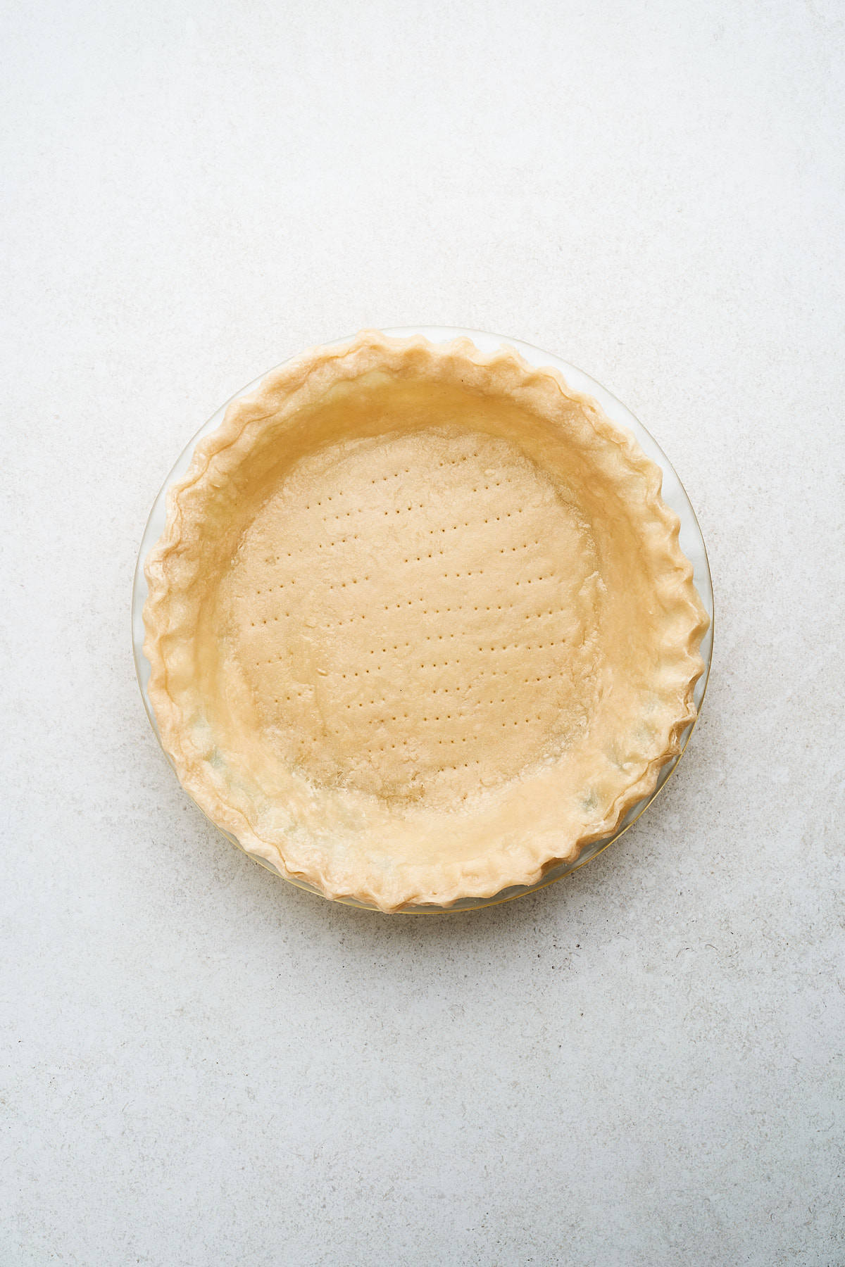 Partially baked pie crust.
