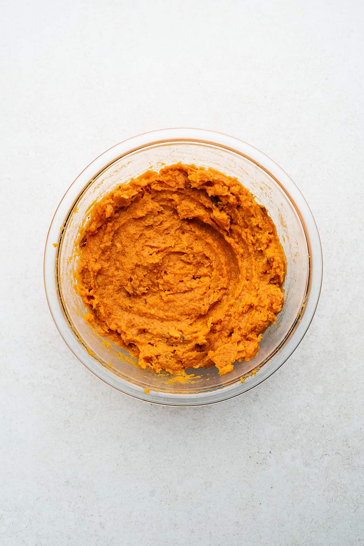 Mashed sweet potatoes in a bowl.