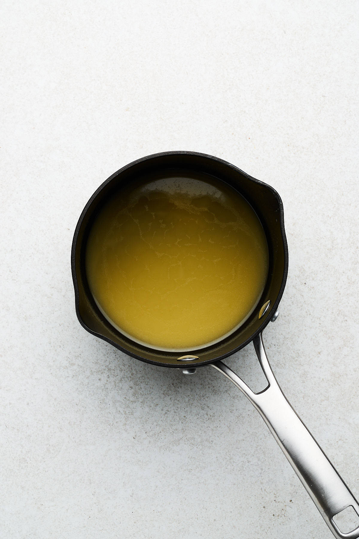 Melted butter in a saucepan.