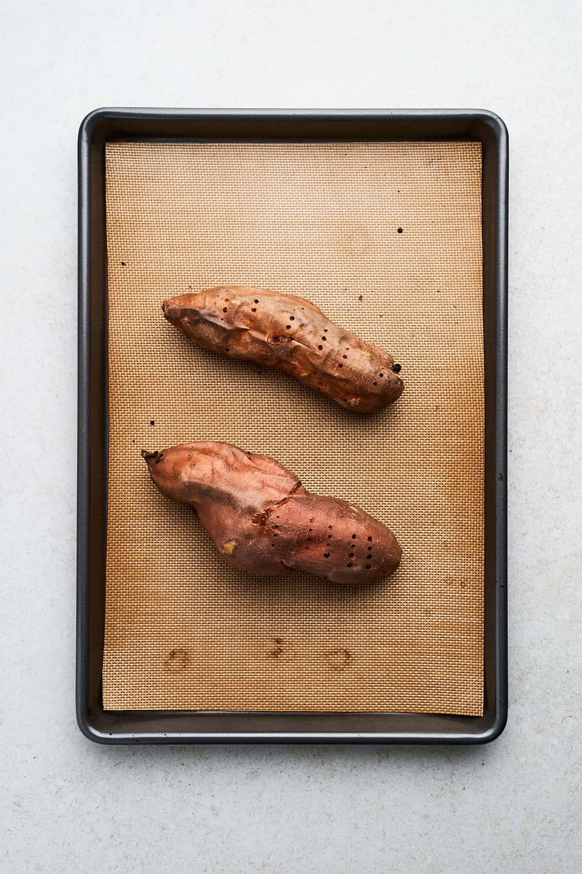 Roasted sweet potato on a pan.