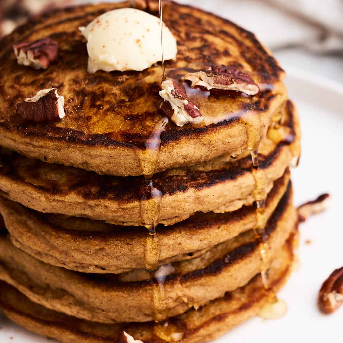Vegan sweet potato pancakes on a plate.