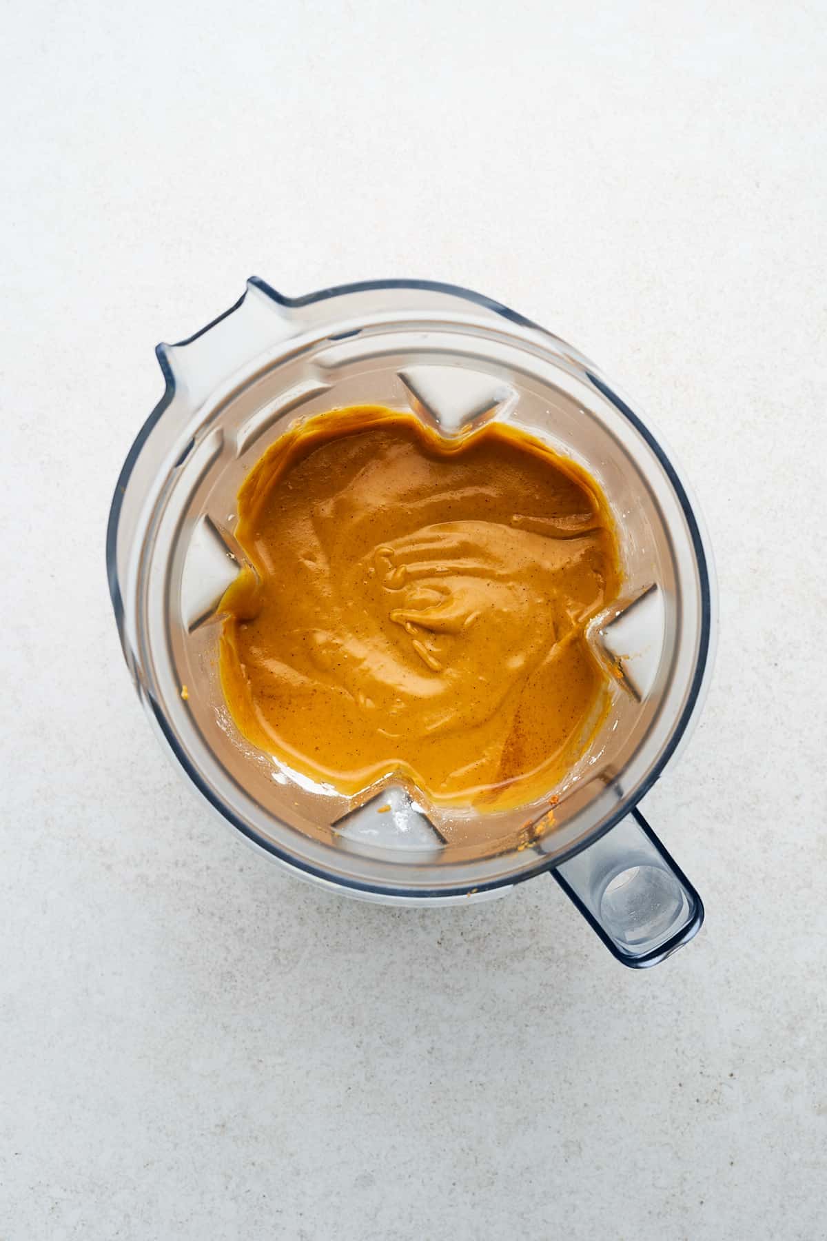 Blended vegan sweet potato pie filling in a blender.