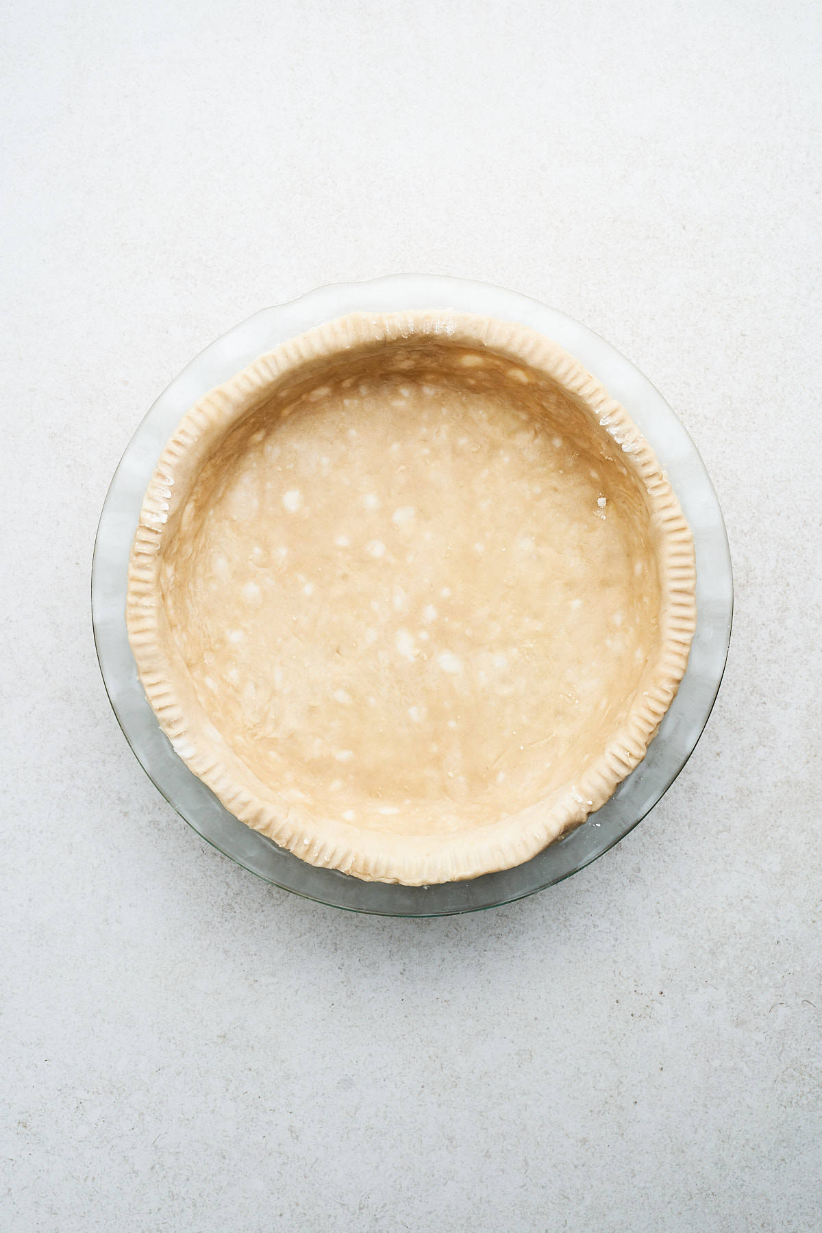 Vegan pie crust in a pan.