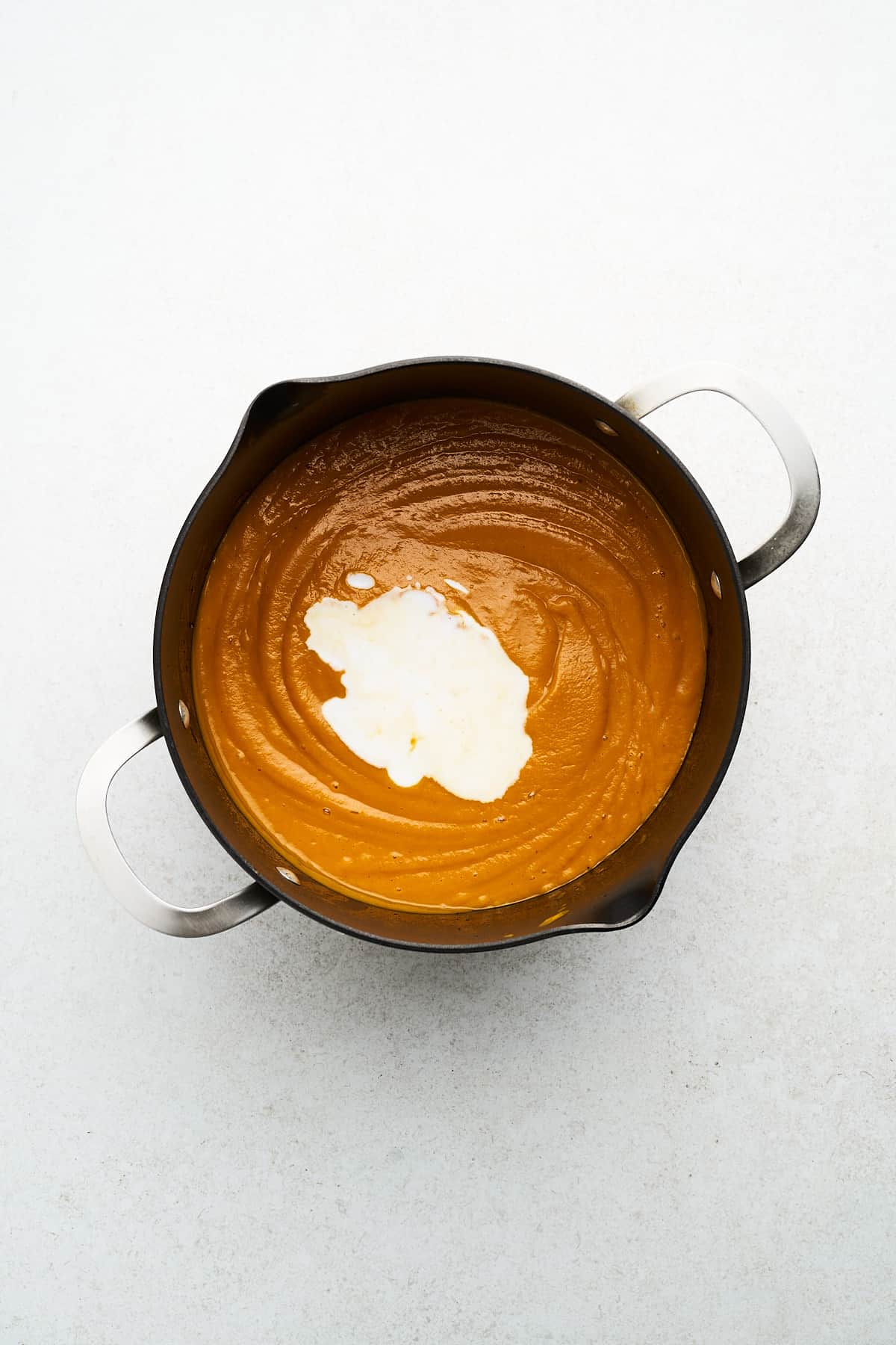 Vegan sweet potato soup in a pot.