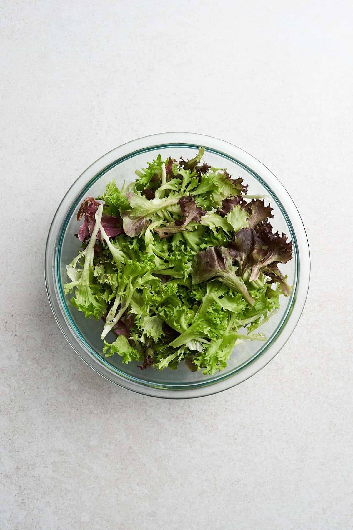 Mixed greens in a bowl.