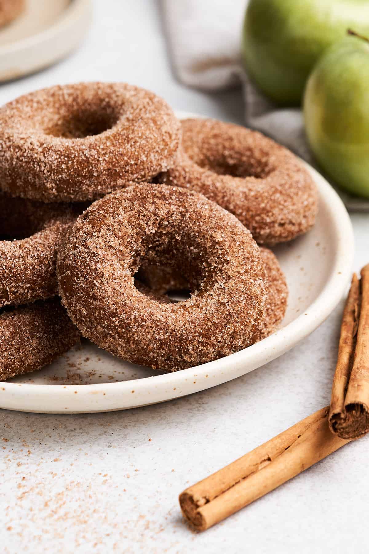 Vegan apple cider donuts on a plate.