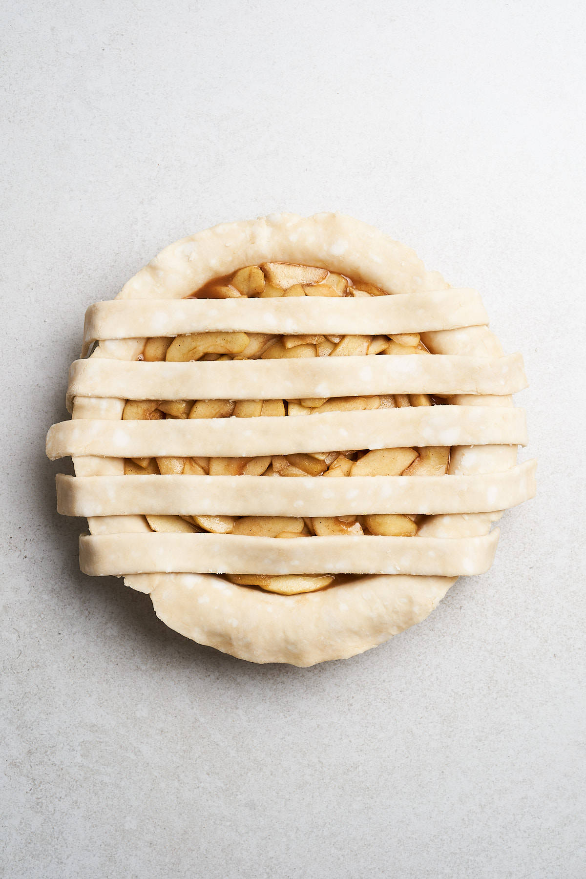 Latticing a pie crust.
