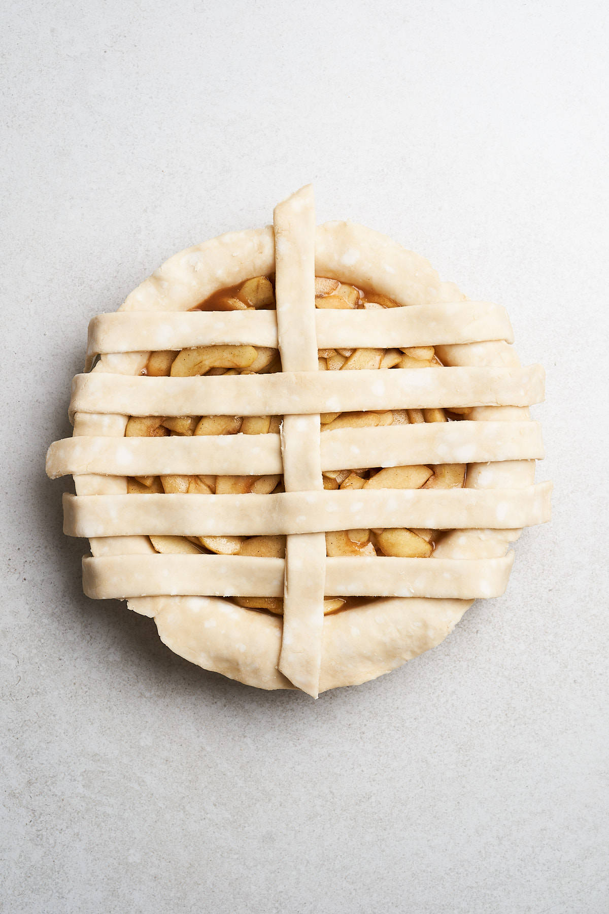 Latticing a pie crust.