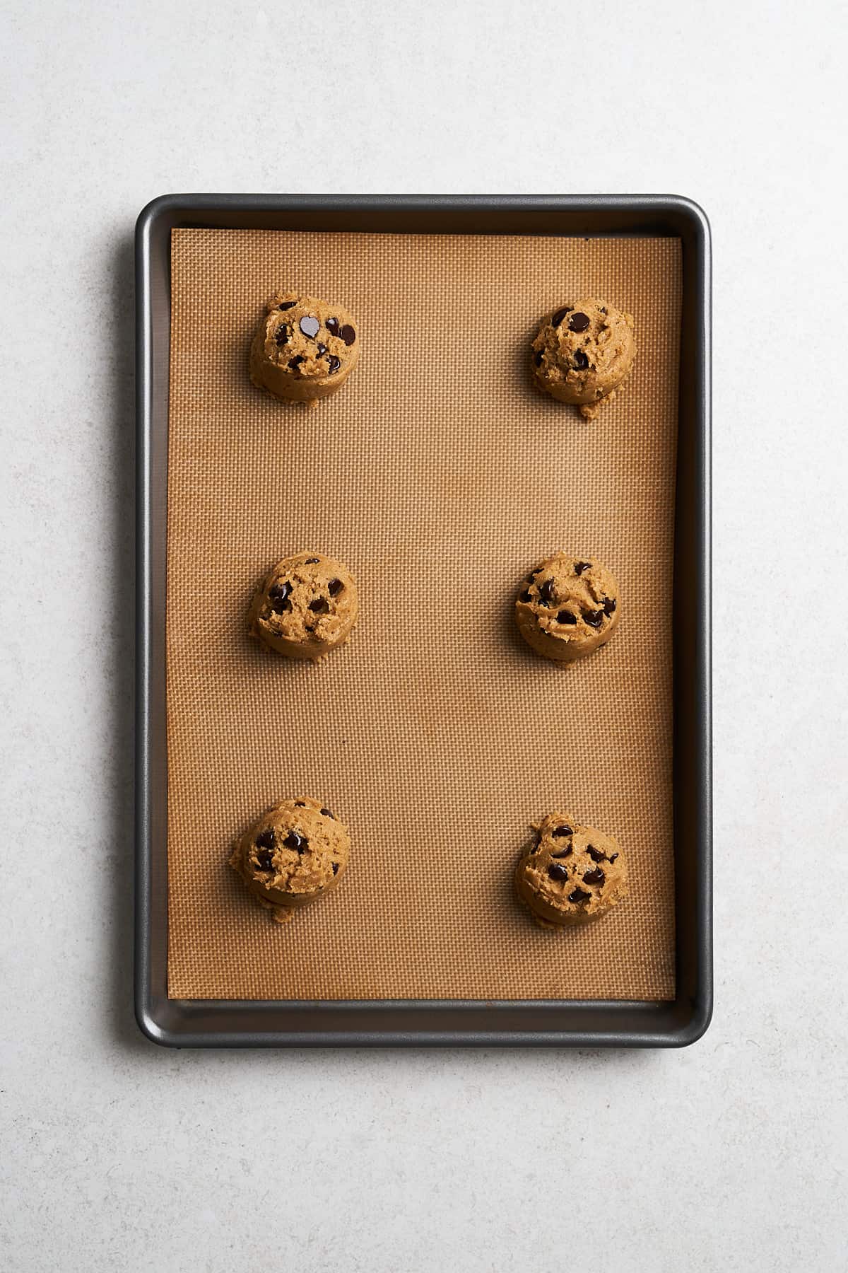 Unbaked chocolate chip cookies.