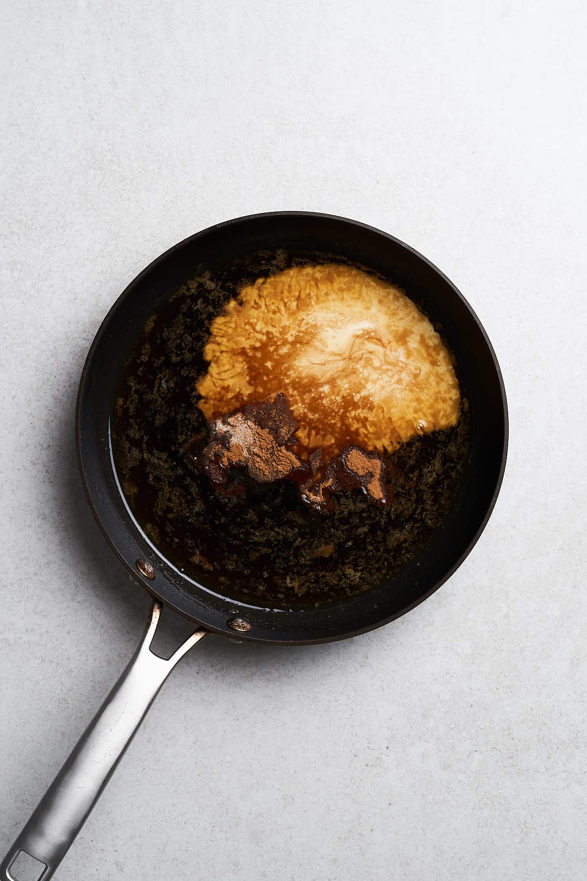 Cornstarch slurry and spices in a pan.