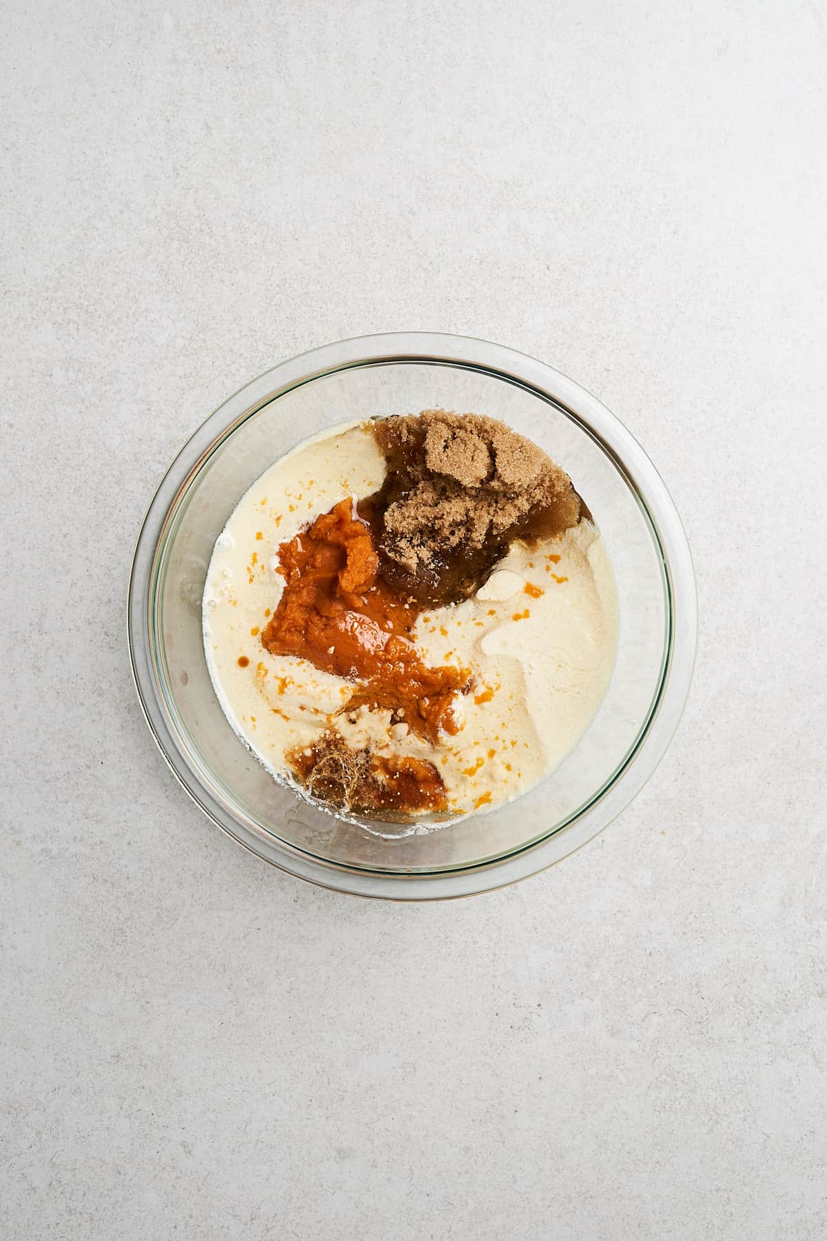 Wet muffin ingredients in a bowl.