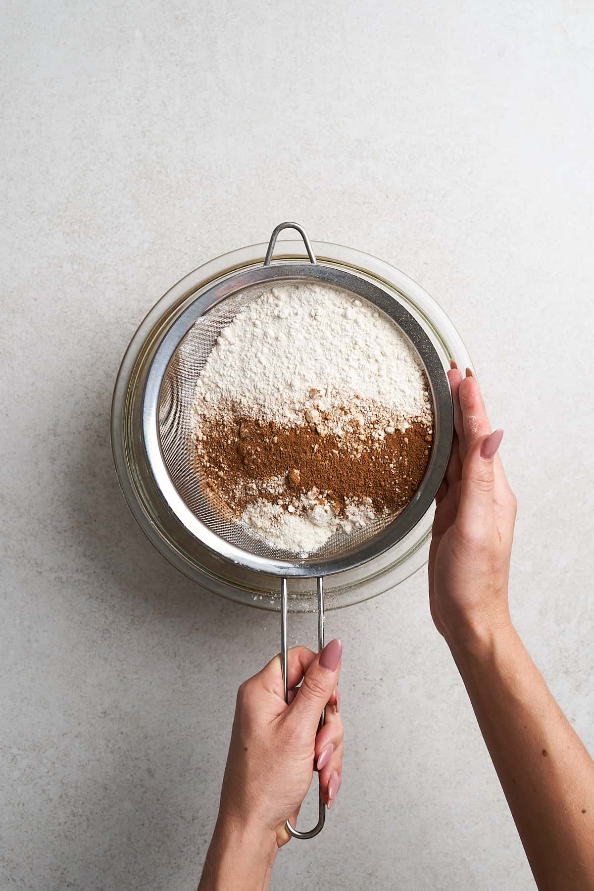 Sifting dry ingredients.
