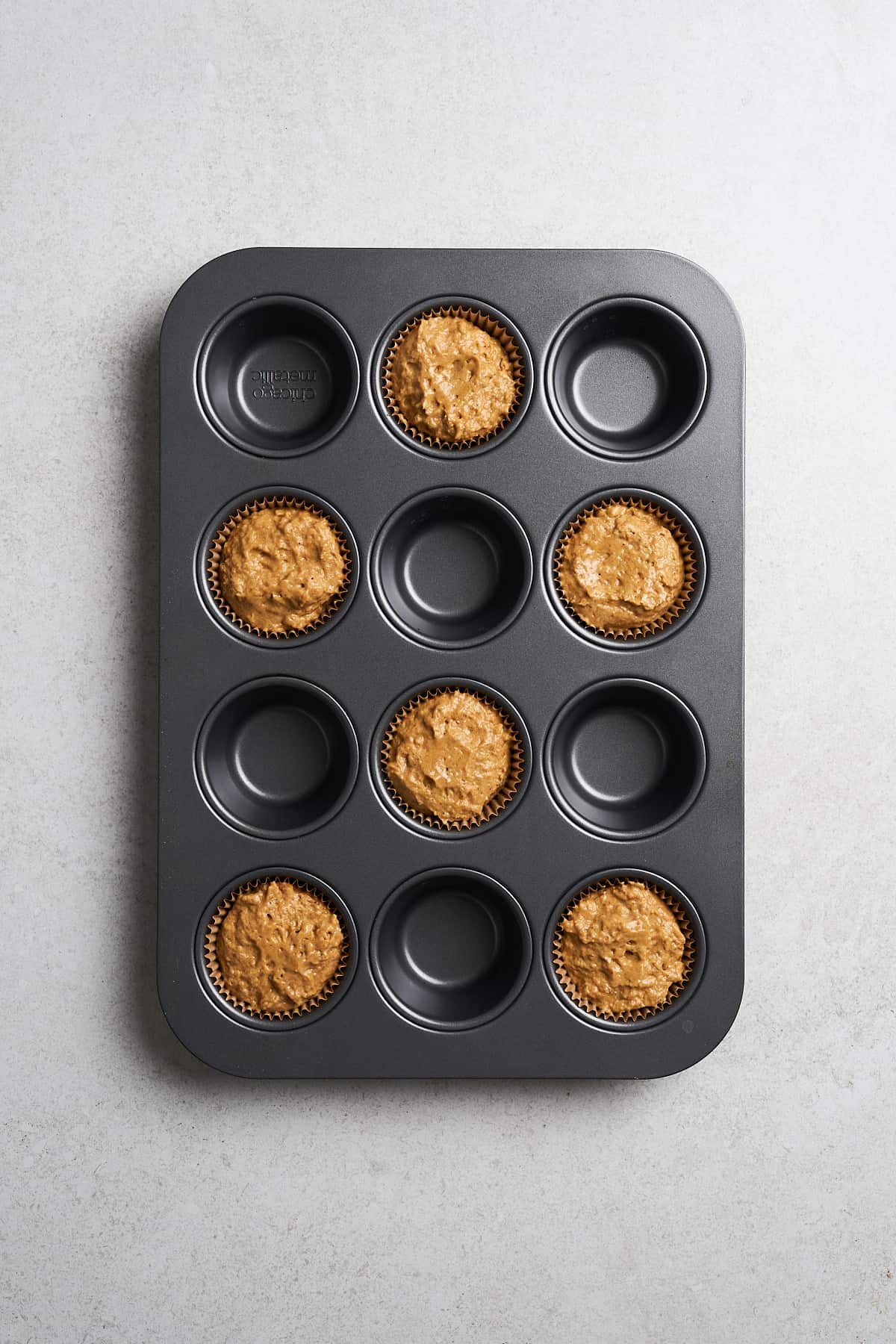 Muffin batter in every other cup.