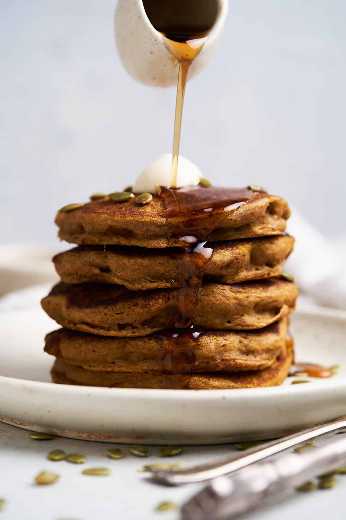 Vegan pumpkin pancakes with syrup.