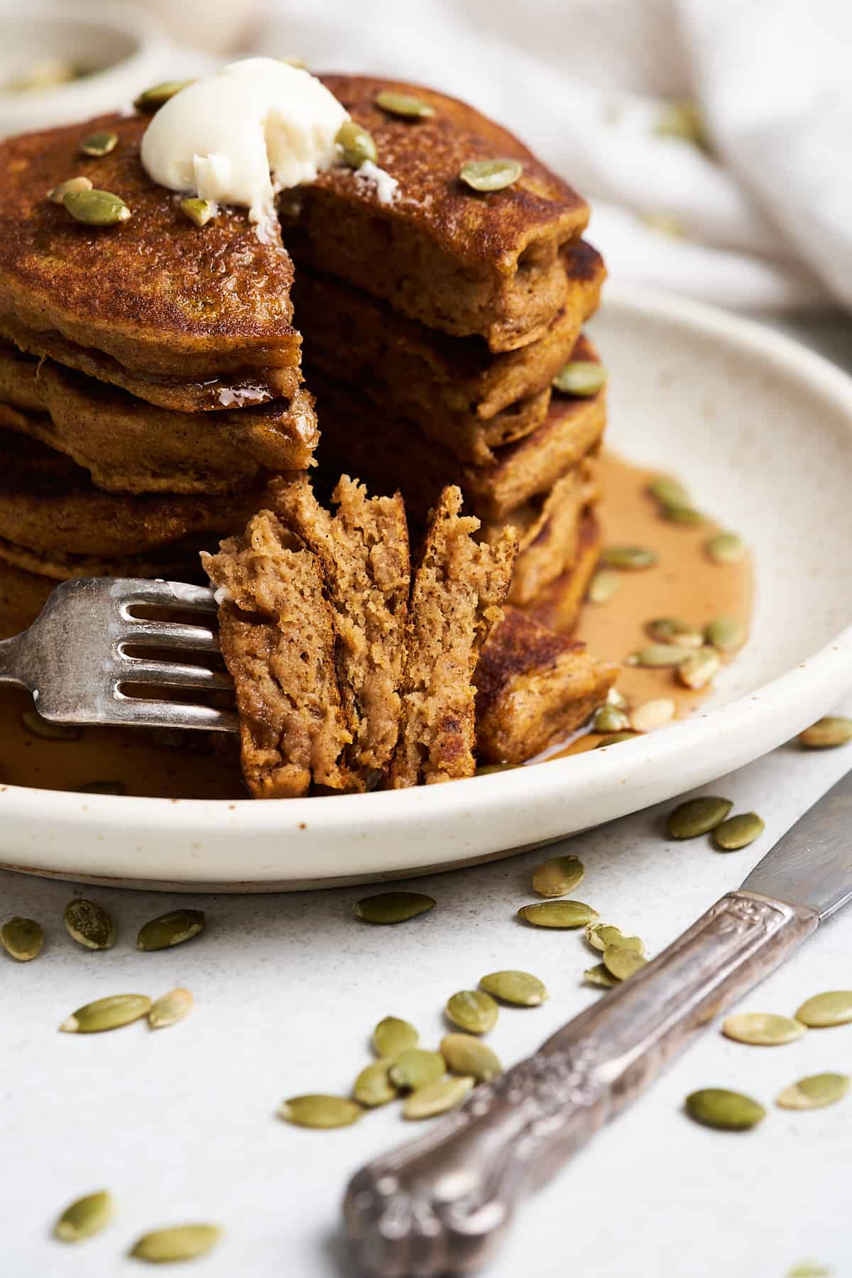 Forkful of vegan pumpkin pancakes.