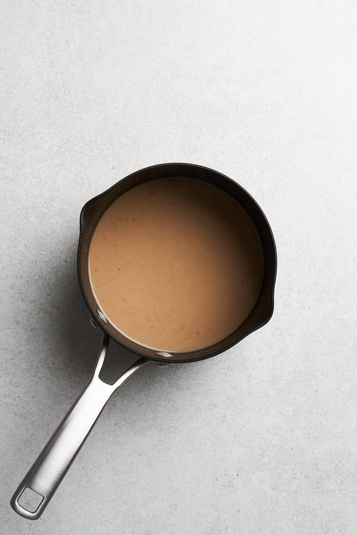 Latte mixture in a saucepan.