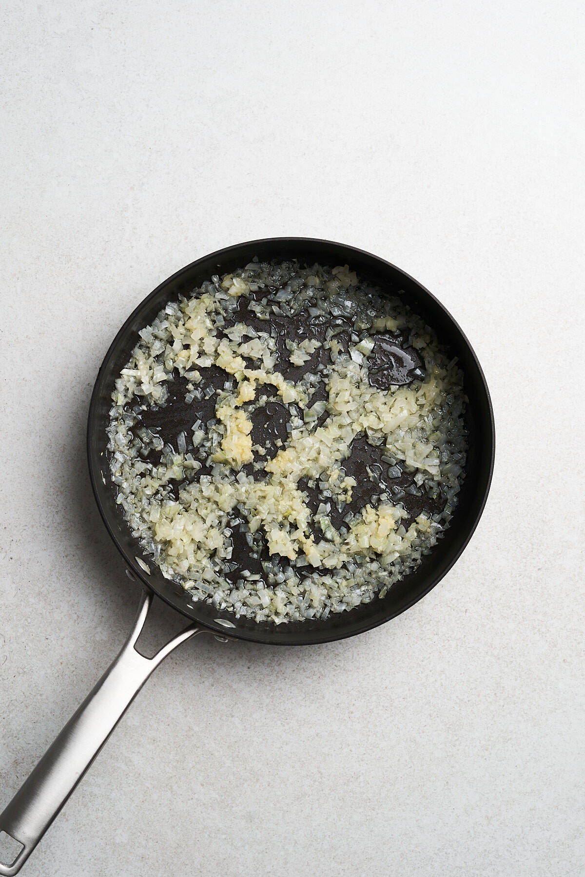 Minced garlic and onion in vegan butter.