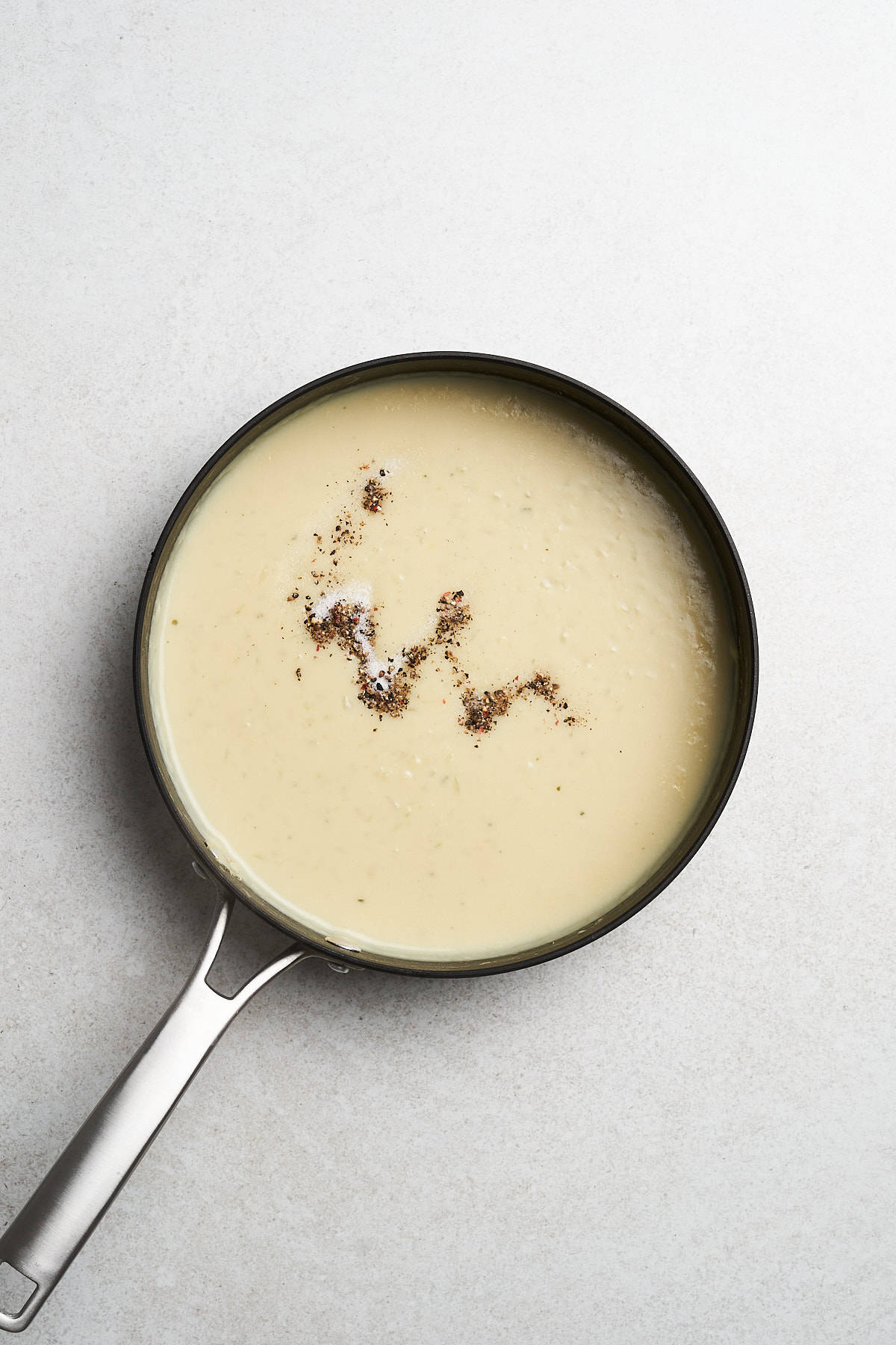 White sauce with garlic, onion, and seasonings.