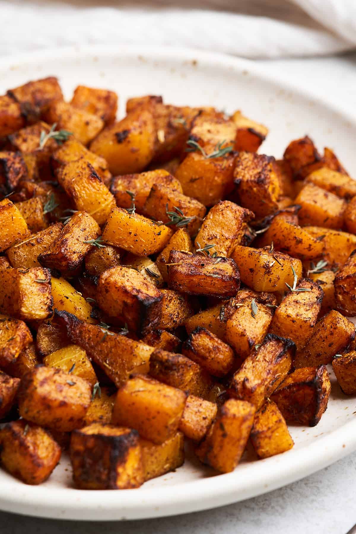 Air fryer butternut squash on a plate.