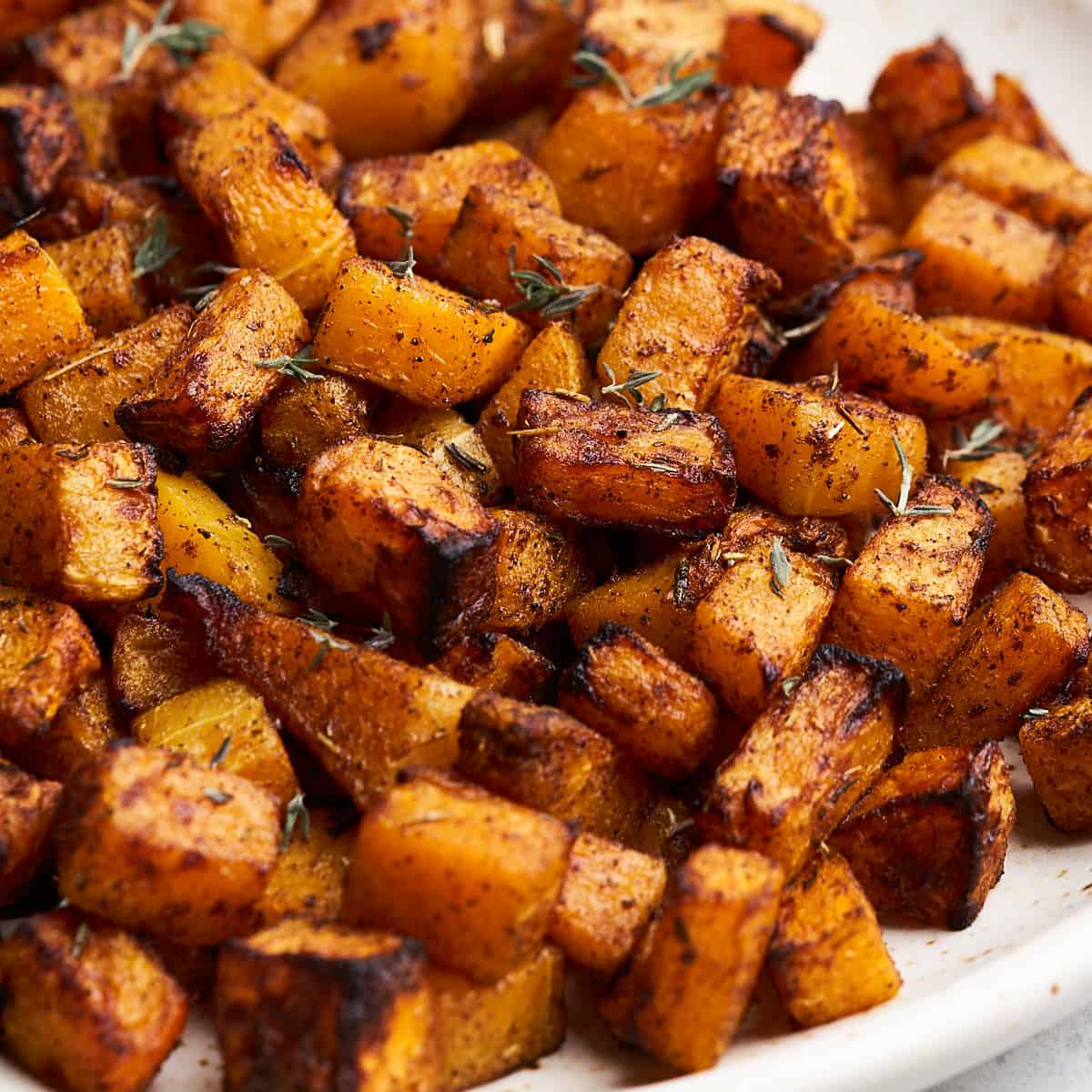Air fryer butternut squash on a plate.