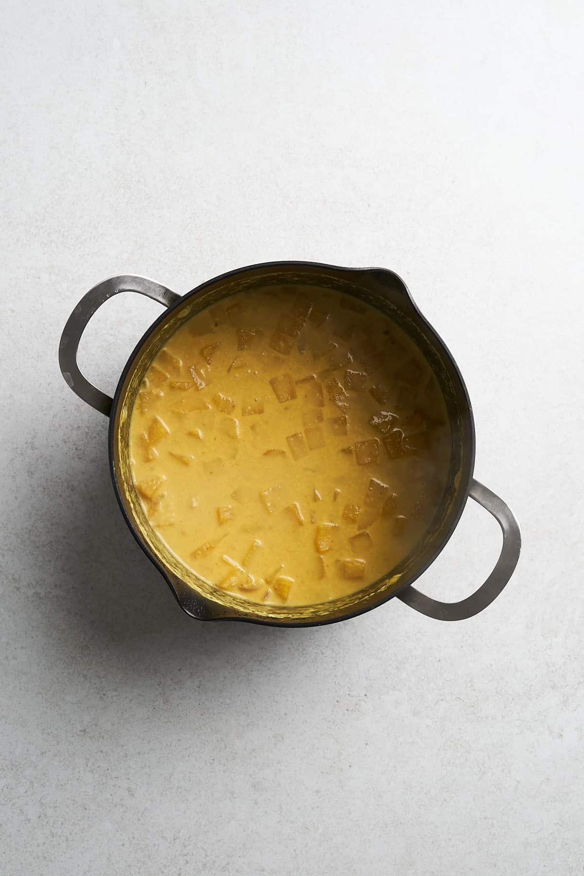 Butternut squash curry in a saucepan.