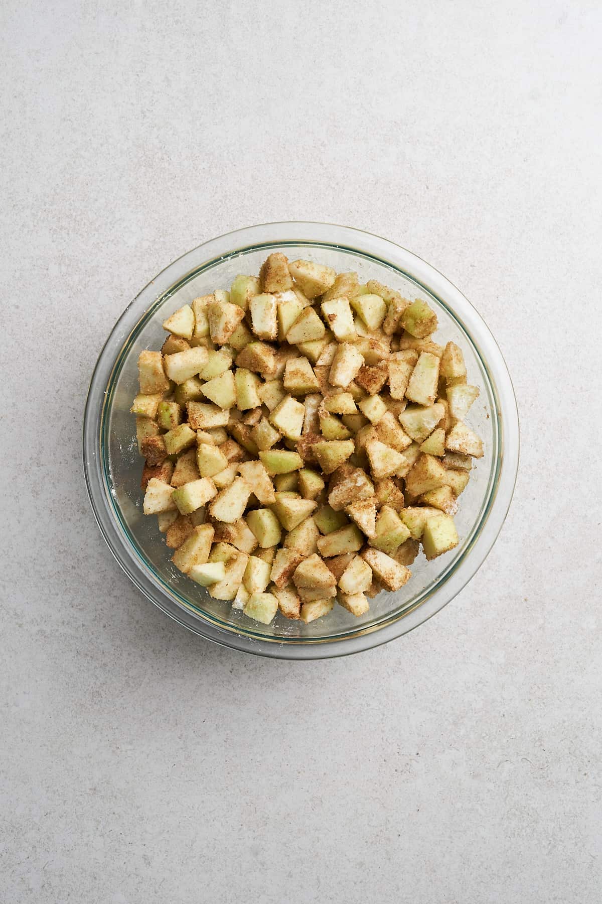 Vegan Apple Crumble in a measuring cup.