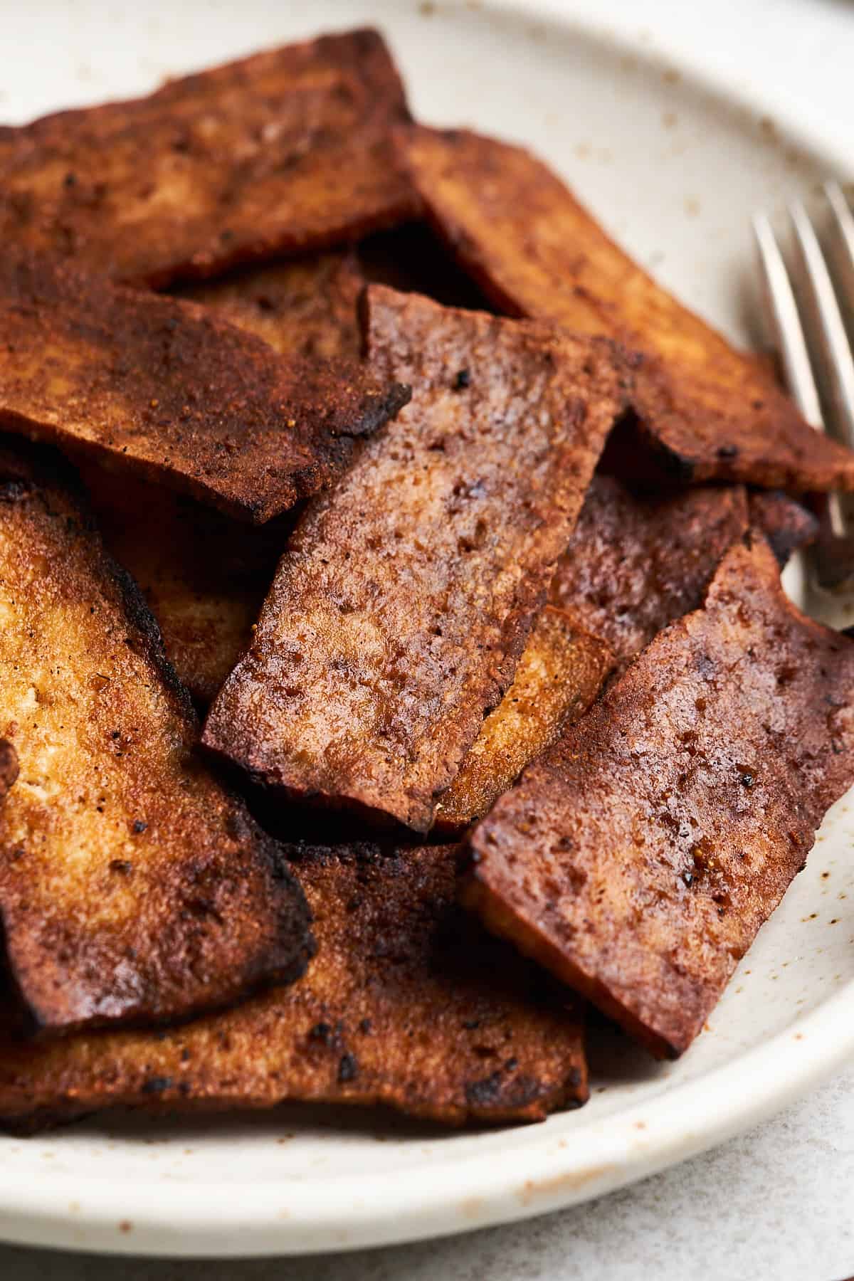 Vegan bacon on a plate.