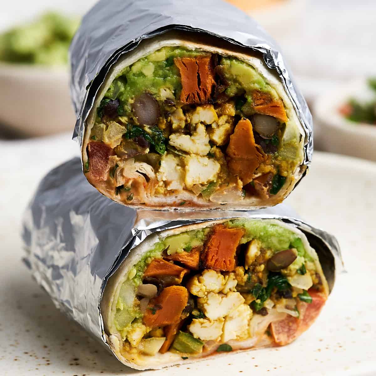 Vegan breakfast burrito on a plate.
