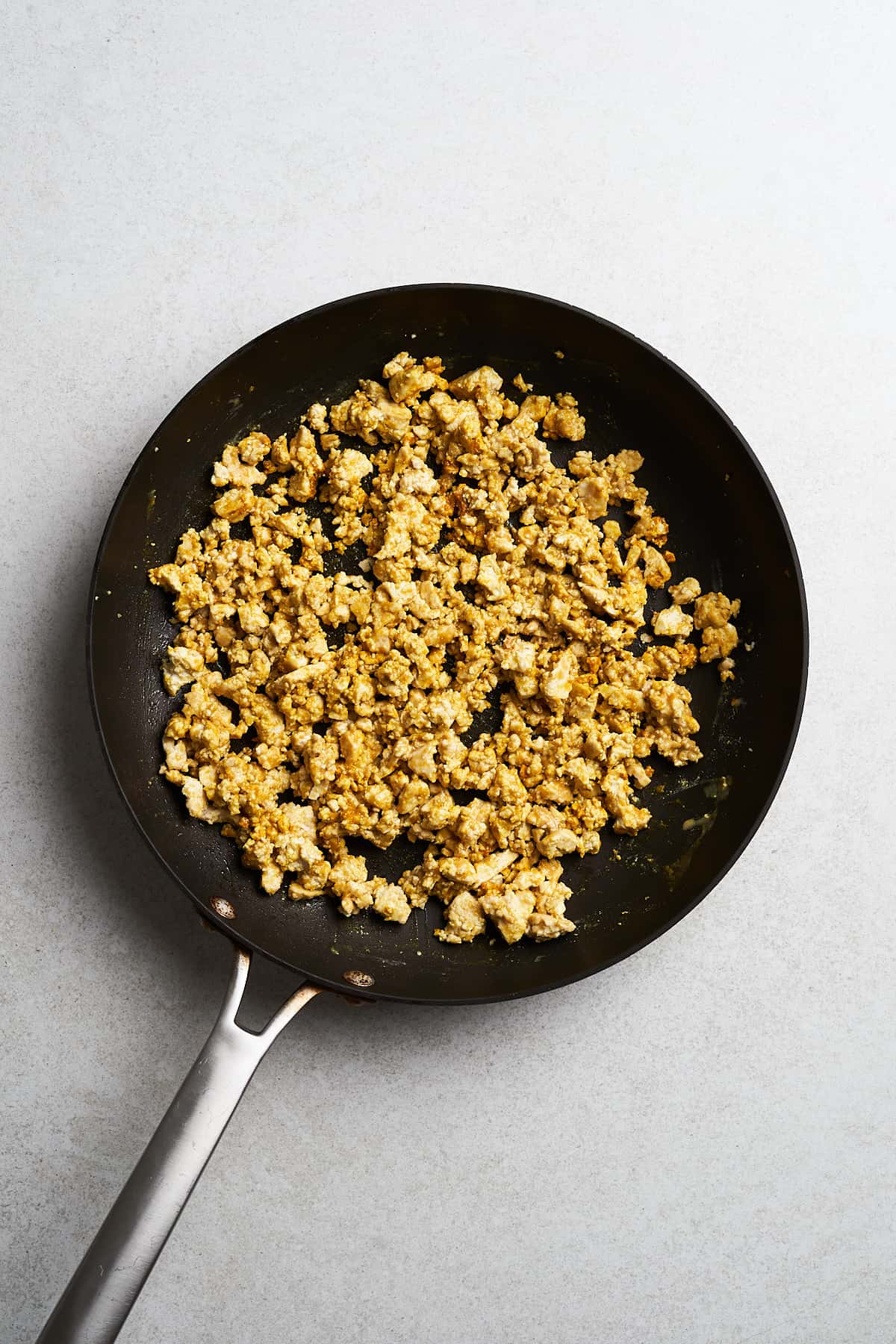 Cooked tofu in a frying pan.