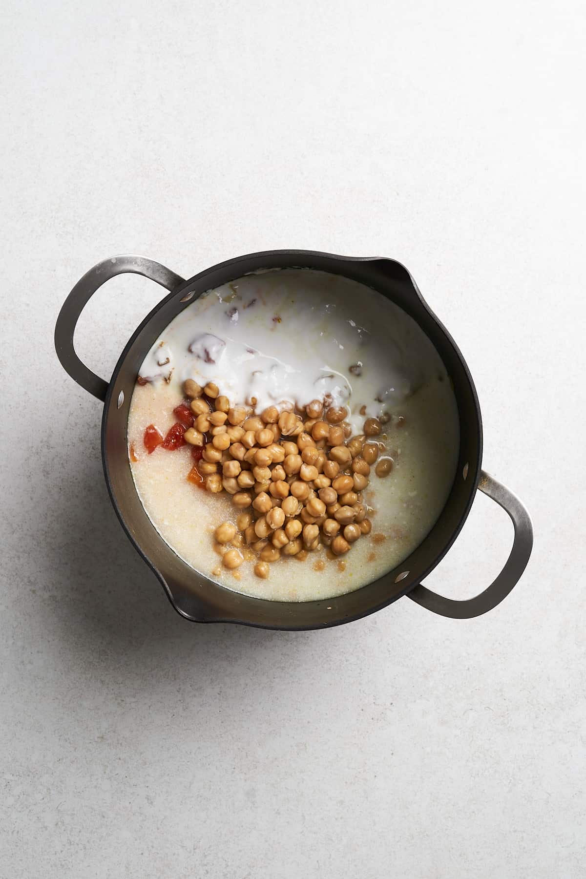 Onions with other ingredients in a pot.