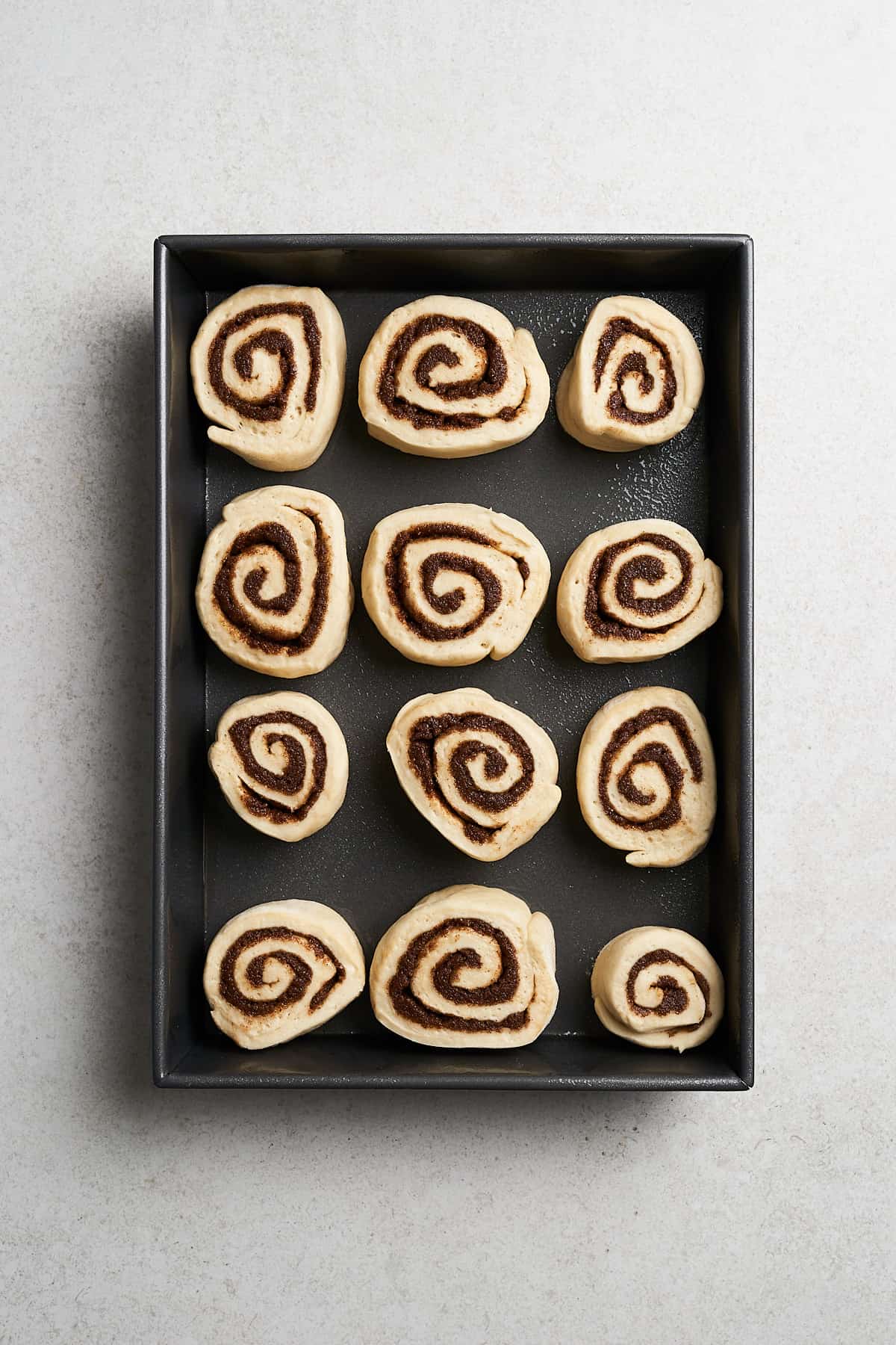 Vegan Cinnamon Rolls and baking sheet.