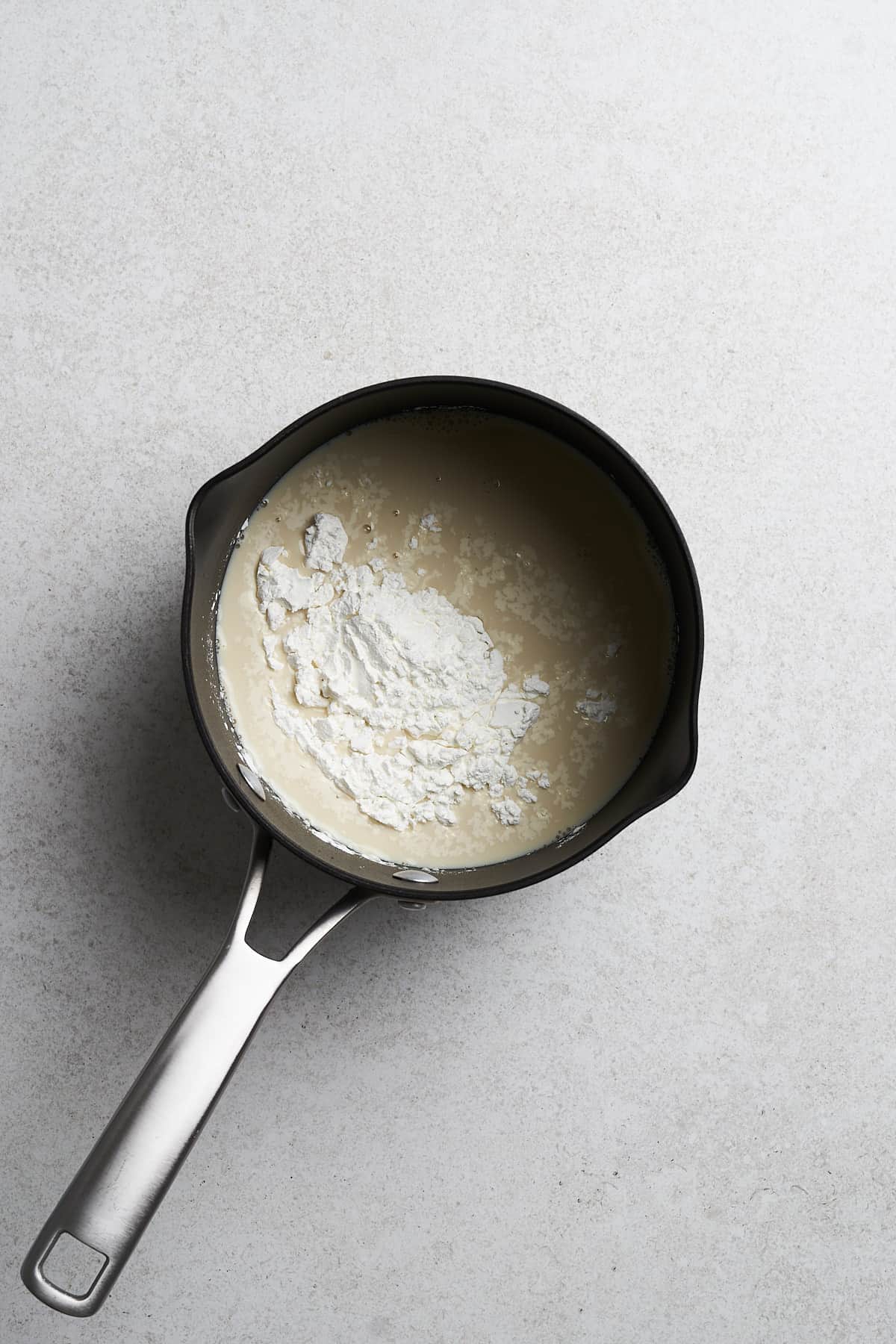 Unboiled soymilk in a saucepan.