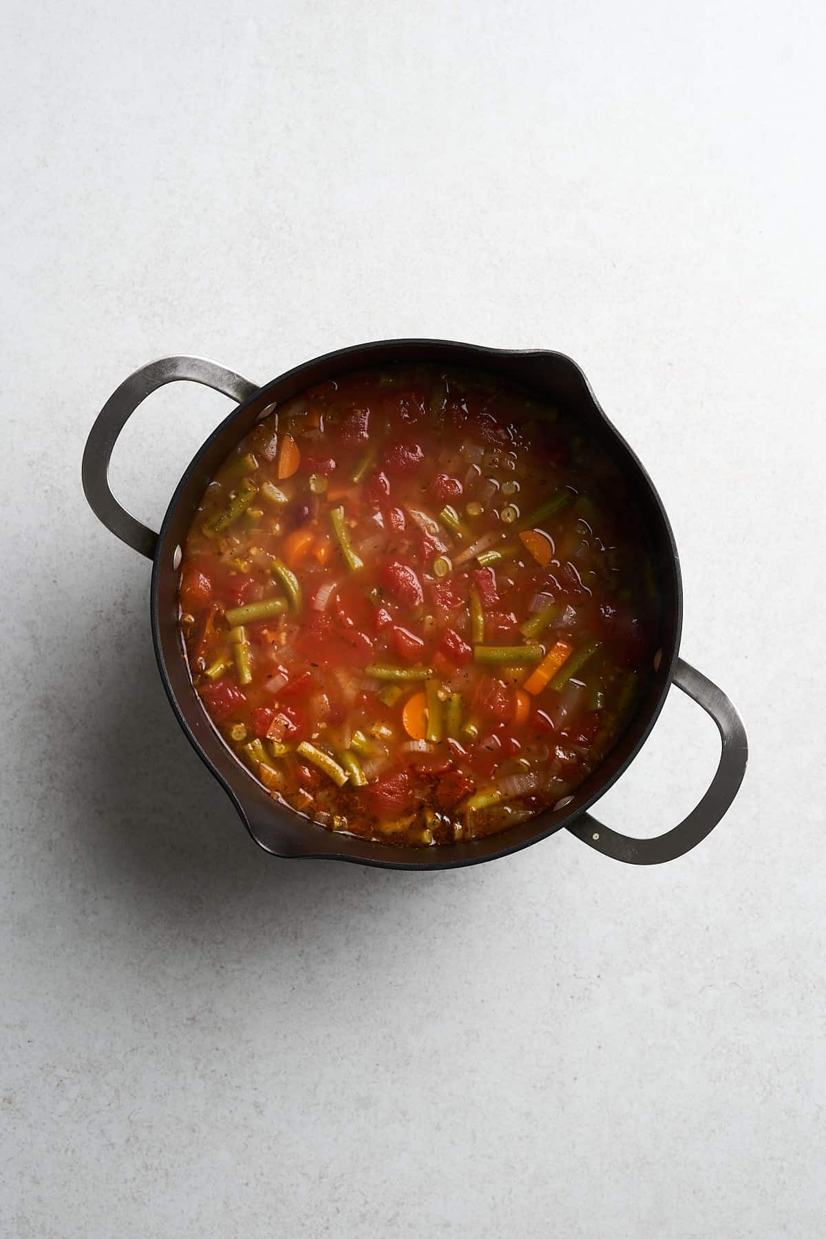 Vegan minestrone soup in a pot.