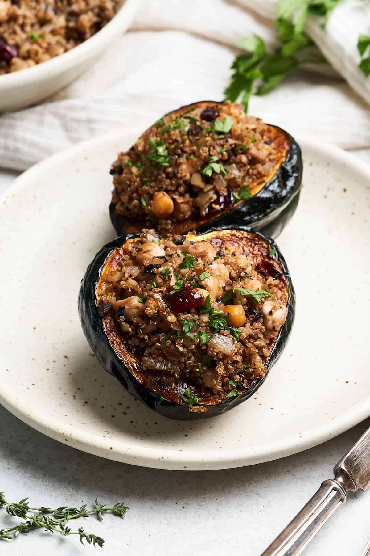 Vegan stuffed acorn squash on a plate.